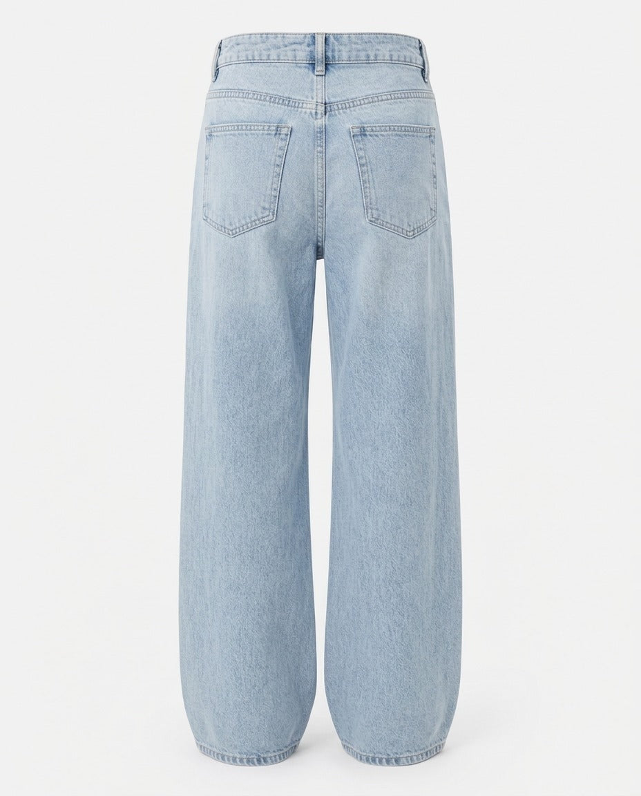 The wide silhouette of the Relaxed Wide-Leg Jean in Washed Denim Blue.