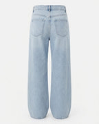 The wide silhouette of the Relaxed Wide-Leg Jean in Washed Denim Blue.
