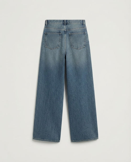 Wide-leg jeans showing crystal embellishment, whiskering and garment wash