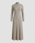 Model wearing Ribbed Knit Flared Midi Dress in Oatmeal, showing the close-cut body.