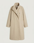 Front view of the stand-collar cocoon coat in oatmeal.