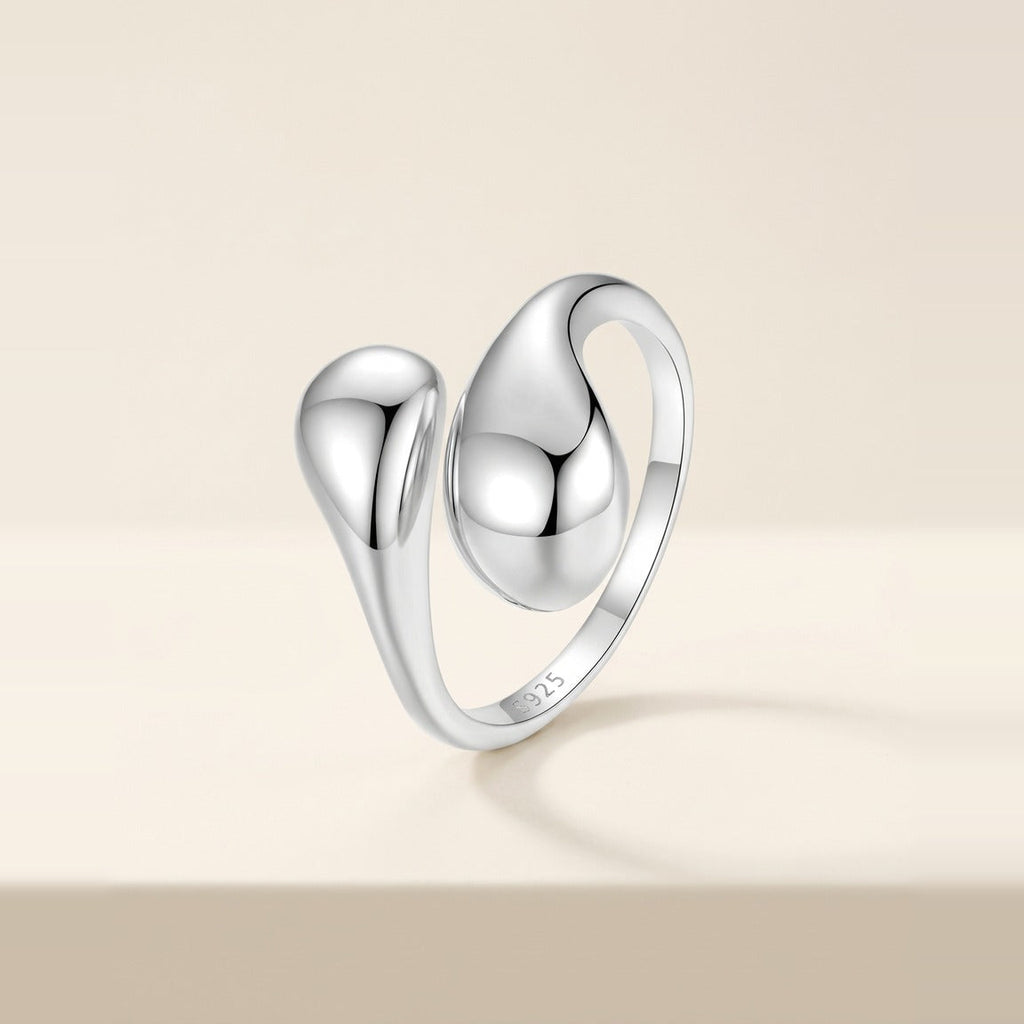 Sculptural cuff ring with two teardrop shapes in Silver