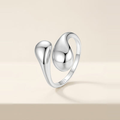 Sculptural cuff ring with two teardrop shapes in Silver