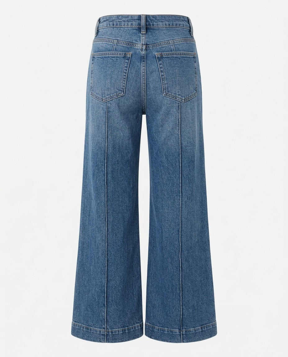 Close up of the high waist and central leg seam detail in Washed Or Mid Denim Blue