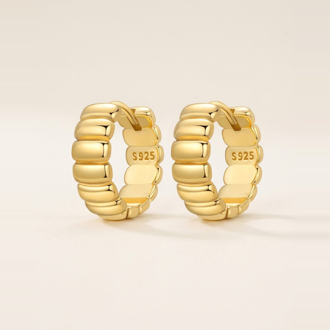 Segmented huggie hoop earrings in silver, hero shot