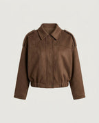 Front view of the structured faux suede blouson jacket in camel with folded collar and gathered hem.
