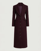 Tailored Maxi Coat in Burgundy, showing the close-cut waist and button placket.