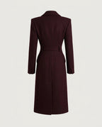 Structured shoulder and peaked lapel of the Burgundy tailored coat.