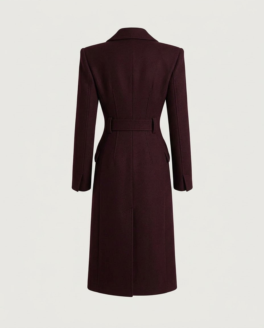 Structured shoulder and peaked lapel of the Burgundy tailored coat.
