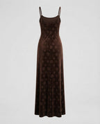 Black velvet slip dress back view showing the straight cut and hem.