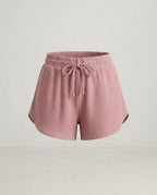 Dusty rose ribbed knit shorts with drawstring waist, front view