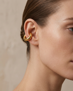 Sculpted Ear Cuff in Gold worn on the ear